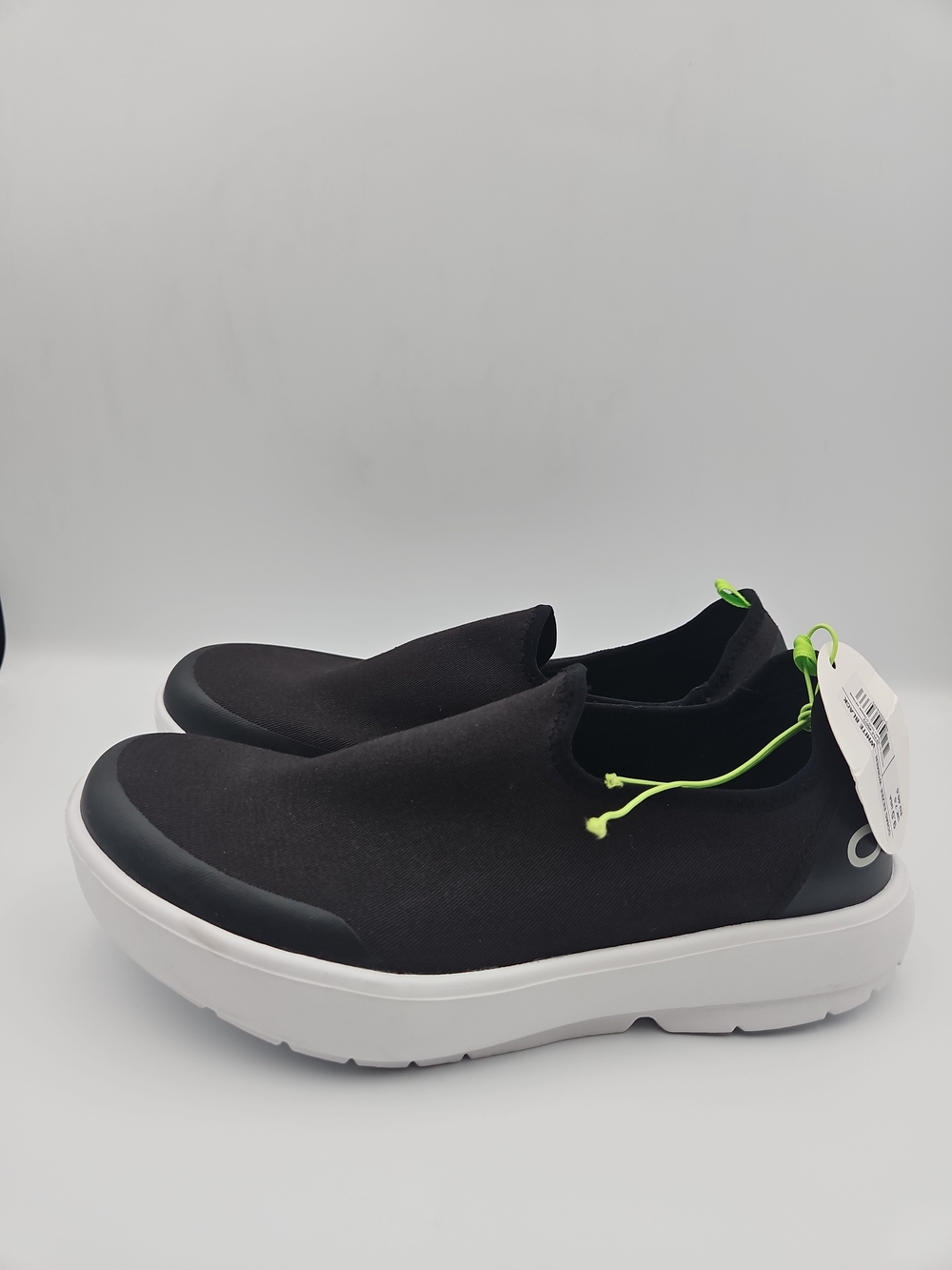 OOFOS Women's Black Slip-On Sneakers with White Sole and Neon Green Accents